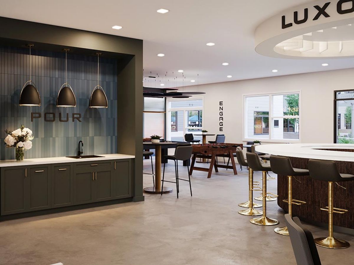 Westrum Corporate Modern cafe lounge with counter seating and a “POUR” coffee station, located near Fort Washington and inspired by Luxor’s elegance.