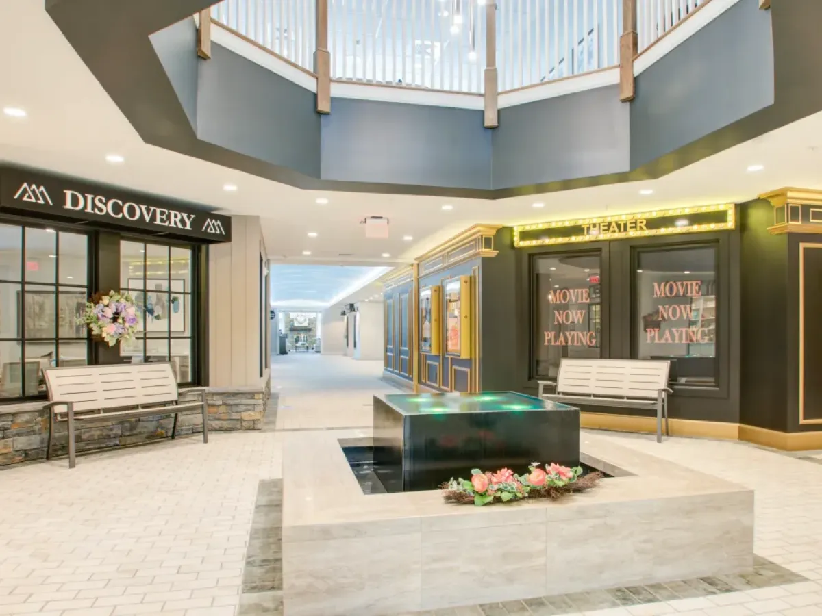 Westrum Corporate Indoor mall in Plymouth Meeting with a central fountain, benches, and shops—near Pinnacle at Plymouth Meeting apartments.